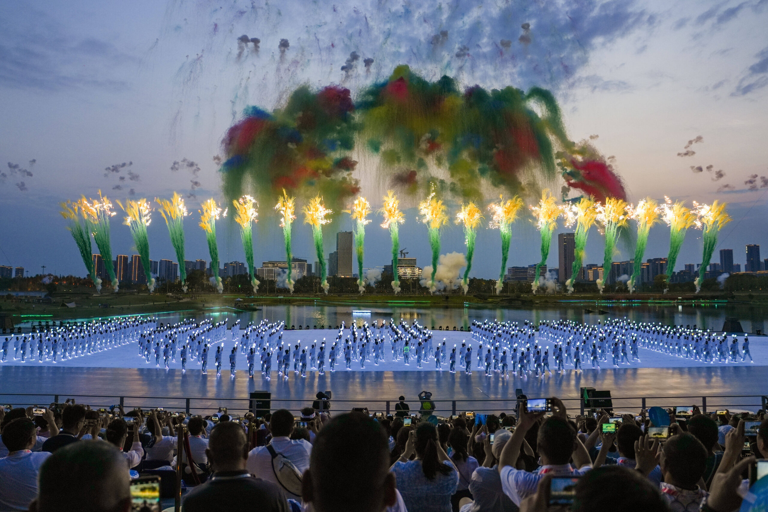 Performers creating the World Games W formation with wireless LED costumes